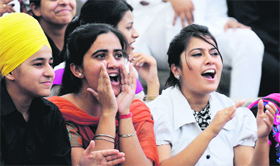 Students cheer for performers during the youth fest at Punjab Agricultural University in Ludhiana on Friday.