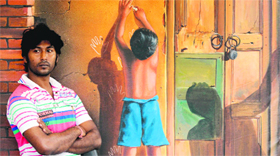 Sanjib Dey, a Kolkata-based artist, with one of his works in Ludhiana.