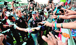 Hes surrounded by fans and media