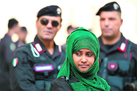 A woman demonstrates at the Montecitorio Palace in Italy to protest against human rights violations and call for democracy in Eritrea. 