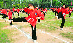 Students of Strawberry Fields World School display martial arts skills at the annual athletics meet of the school held in Chandigarh on Saturday