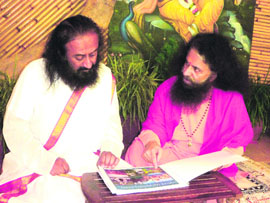 Revered spiritual gurus Shri Shri Ravi Shankar and Swami Chidanand Muni at Parmarth Niketan Ashram in Haridwar on Saturday.