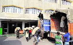 Trunks and records being dumped into trucks as the Durbar Move is underway in Srinagar