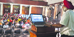 Medical oncologist Dr Navdeep Singh addresses students during an interactive session to mark the National Breast Cancer Awareness Month at the Government College for Girls in Ludhiana  on Saturday. Photo by: Inderjeet Verma