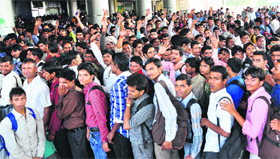 Aspirants wait to buy tickets at the Chandigarh railway station on Sunday.