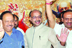 BJP chief ministerial candidate Harsh Vardhan with Delhi party president Vijay Goel during a press conference at party office in New Delhi on Sunday. 