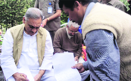 Uttarakhand Chief Minister Vijay Bahuguna receives applications from general public regarding their problems during his visit to Pithoragarh on Sunday.