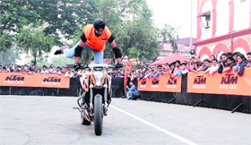 A biker performs a stunt at Doon Club in Dehradun on Sunday.