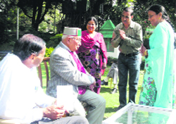Brij Behari Lal Butail listens to public grievances in Palampur on Sunday. 