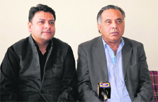 Ministers Sudhir Sharma and GS Bali talk to mediapersons in Dharamsala on Sunday. 