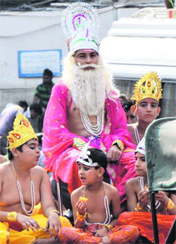 Children dress up as Lord Vishwakarma during a shobha yatra taken out by the Pradesh Vishwakarma Sabha in Jammu on Sunday.