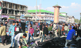 Shoppers at a market in Srinagar on Sunday.