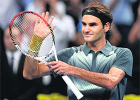 Roger Federer celebrates after winning his semifinal against Vasek Pospisil at the Swiss Indoors tennis tournament in Basel