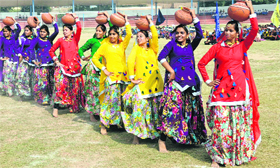 In sync: Students of RBDAV School present a cultural item during the inaugural ceremony of the 59th Punjab State School Sports Tournament in Bathinda on Monday.