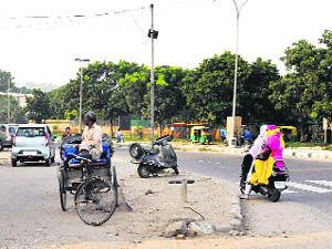 Rickshaw parked on the slip road of Sector 42 on Monday. 