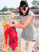 A girl removes garbage from the Ganga canal in Haridwar on Monday. Tribune photo: Rameshwar Gaur