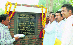 Dr KV Singh, OSD (Media) to Chief Minister lays foundation stone of a waterworks project at Kaluana in Sirsa. A Tribune photograph