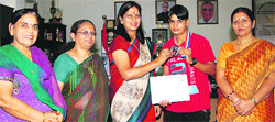 Pankaj Mittal, Vice-Chancellor of Bhagat Phool Singh Women University, Khanpur Kalan, and Registrar Asha Kadian (Left), welcome Renu on her arrival in the university after winning the silver medal in the North Zonw Boxing Championship. Photo: BS Malik