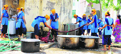 Rangers of GVM Girls College, Sonepat, wash clothes during kar seva at Gurdwara Shri Guru Tegbahadur in Sector 15, Sonepat. Photo: BS Malik