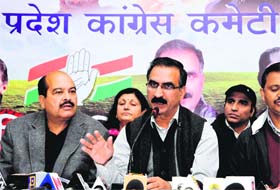 Sukhvinder Singh, state BJP chief, and Harsh Mahajan, vice-president of the HPCC, address mediapersons in Shimla on Monday