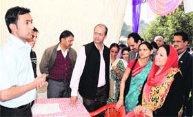 MP Pratibha Singh interacts with company representatives at the Rozgar Mela in Mandi on Monday