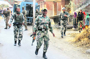 Security personnel during a search operation at Rohmoo in Pulwama district on Monday. 