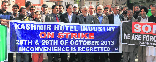 Members of the hotel industry protest against the government in Srinagar on Monday. 