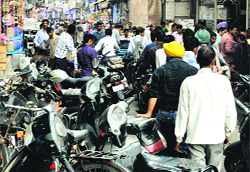 Encroachments by shopkeepers in the Sadar Bazar area in Ludhiana have reduced the width of the road considerably.