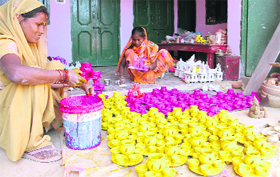 Artisans prepare pottery ahead of Diwali in Dehradun on Tuesday.