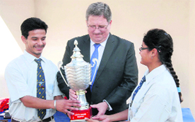 Chief guest David Hilton gives a prize to the winners at The Aryan School in Dehradun on Tuesday.