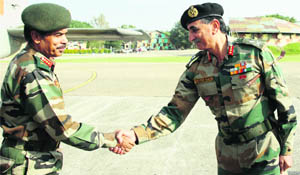 Lt Gen Philip Campose, GOC-in-C, Western Command, being received by Lt Gen Praveen Bakshi, GOC, Rising Star Corps, at the Jammu Technical Airport on Tuesday. 