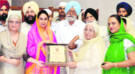 Office-bearers of the Sidhwan Group of Educational Institutions honour Harsimrat Kaur Badal, MP, at a function at Sidhwan Khurd near Jagraon on Tuesday.