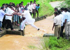 Former Union minister K Chiranjeevi accidentally falls into flood waters while on a visit to rain-hit areas of East Godavari district of Andhra Pradesh on Monday