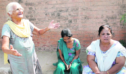 The patients kin outside the Raman Mandi Civil Hospital. Tribune photo: Pawan Sharma 