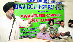 Lawyer Pritam Singh speaks at the seminar held at DAV College on Wednesday. Tribune photo: Pawan Sharma