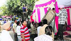 Officials of the UT Estate Office and Municipal Corporation get illegal tents removed during an anti-encroachment drive at the Sector 26 Grain Market in Chandigarh on Wednesday