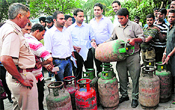 Officials of the UT Food and Supplies Department inspect LPG cylinders in Sector 27, Chandigarh, on Wednesday