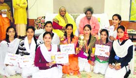 The winners of the National Yoga Championship held at Palwal in Haryana recently with Dev Sanskriti University head Dr Pranav Pandya in Haridwar on Wednesday