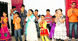 Children of Asha School present a cultural item to celebrate Diwali on the school campus in Jammu on Wednesday