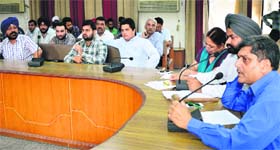 The auction of vanity numbers under way at the Bachat Bhawan in Ludhiana on Wednesday