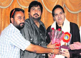 SM Sadiq (right) being honoured by local singers in Ludhiana on Wednesday