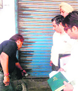 An MC team seals a shop in Amritsar on Thursday. 