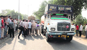 Police at the spot where a man was killed on Mansa road.