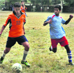 Players in action in a match during the Jaideep Bhandari Memorial Football Tournament in Dehradun on Thursday. A Tribune photograph
