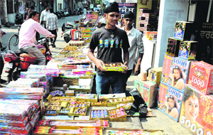 Crackers being sold at an illegal stall in Gandhi Market on Friday. 