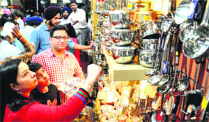 Residents buy utensils on Dhanteras in Chandigarh on Friday.