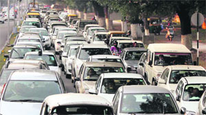 Vehicles stuck in a traffic jam on the road separating Sectors 19 and 20 in Chandigarh on Friday.
