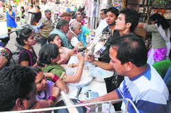 People buy utensils on the occasion of Dhanteras in Dehradun on Friday. A Tribune photograph