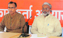 Luxmi Jaiswal (right), district chief of the RSS, addresses mediapersons in Dehradun on Friday. A Tribune photograph