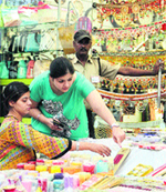 With a day left for Diwali, heavy rush of people at the Model Town market in >> Jalandhar. Photo: Sarabjit Singh